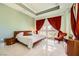 Comfortable main bedroom with tray ceiling, red curtains, and bright view at 2455 W Serene Ave # 923, Las Vegas, NV 89123