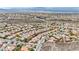 Wide aerial shot of the beautiful neighborhood nestled in the desert mountains at 2571 Thatcher Ave, Henderson, NV 89052
