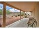 Relaxing covered patio with desert landscaping views, perfect for enjoying outdoor living in style at 2571 Thatcher Ave, Henderson, NV 89052