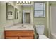 Bathroom features a vanity with a mirror, a toilet, and a shower/tub combination at 2571 Thatcher Ave, Henderson, NV 89052
