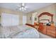 Bedroom with neutral walls, ceiling fan, closet and decorative furniture at 2571 Thatcher Ave, Henderson, NV 89052
