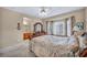 Bedroom featuring a king bed, neutral carpet, and a view into the bathroom at 2571 Thatcher Ave, Henderson, NV 89052