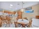 Well-lit dining area with a combination of pendant and recessed lighting, adjacent to the kitchen at 2571 Thatcher Ave, Henderson, NV 89052