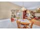 Bright dining area with a view of the backyard, complemented by a classic dining set at 2571 Thatcher Ave, Henderson, NV 89052