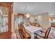 Bright dining room showcasing table with seating for eight and an antique cabinet at 2571 Thatcher Ave, Henderson, NV 89052