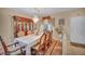 Dining room features a chandelier, furniture, and a large table with seating for eight at 2571 Thatcher Ave, Henderson, NV 89052