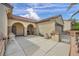 Beautiful home exterior featuring a patio, desert landscaping, and a well-maintained facade at 2571 Thatcher Ave, Henderson, NV 89052