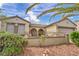 Inviting single-story home with desert landscaping, arched patio, and desert foliage, perfect for relaxing outdoors at 2571 Thatcher Ave, Henderson, NV 89052
