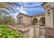 Beautiful home featuring a charming patio, desert landscaping, and a well-maintained exterior at 2571 Thatcher Ave, Henderson, NV 89052