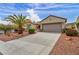 Attractive single-story home with a spacious driveway leading to an attached two-car garage at 2571 Thatcher Ave, Henderson, NV 89052