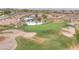 Picturesque golf course with sand traps, a waterfall, and a lush green putting surface at 2571 Thatcher Ave, Henderson, NV 89052