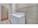 Laundry room with tile floors, wire shelving, and washer and dryer hookups at 2571 Thatcher Ave, Henderson, NV 89052