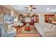 Warm and inviting living room featuring hardwood floors, large windows, and comfortable seating at 2571 Thatcher Ave, Henderson, NV 89052