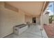Covered patio with concrete floor, exterior entrance, bench, and storage in a well-maintained outdoor space at 2571 Thatcher Ave, Henderson, NV 89052