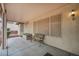 Covered patio featuring neutral colors, outdoor seating, and sunshades to ensure comfort and privacy at 2571 Thatcher Ave, Henderson, NV 89052