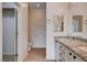 Bright bathroom features granite counters, chrome hardware, tile flooring and a walk-in closet at 2621 Ground Robin Dr, North Las Vegas, NV 89084