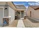 Close-up of the home's entrance showcasing stone accents and a well-lit walkway at 2621 Ground Robin Dr, North Las Vegas, NV 89084