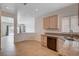 Sunlit kitchen offering granite countertops with stainless steel dishwasher at 2621 Ground Robin Dr, North Las Vegas, NV 89084