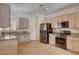 Well-equipped kitchen with granite countertops and stainless steel appliances at 2621 Ground Robin Dr, North Las Vegas, NV 89084