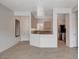 Living room featuring tile floors and an open layout connecting to the kitchen at 2621 Ground Robin Dr, North Las Vegas, NV 89084