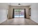 Spacious living area with tile flooring and sliding glass doors leading to a refreshing pool at 2621 Ground Robin Dr, North Las Vegas, NV 89084