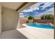 Inviting backyard pool with decorative planters and privacy wall, ideal for relaxation and entertainment at 2621 Ground Robin Dr, North Las Vegas, NV 89084