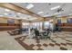 Bright community room with tables, chairs, and plenty of natural light at 2621 Ground Robin Dr, North Las Vegas, NV 89084