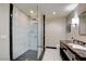 Modern bathroom featuring an elegant shower and a dark granite vanity at 2700 Las Vegas Blvd # 2303, Las Vegas, NV 89109