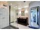 Modern bathroom with walk-in shower, granite vanity, and elegant marble tile at 2700 Las Vegas Blvd # 2303, Las Vegas, NV 89109