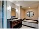 Luxurious bathroom with a soaking tub, granite countertop vanity, and modern fixtures at 2700 Las Vegas Blvd # 2303, Las Vegas, NV 89109