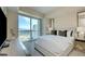 Bright bedroom features a large window with city views, comfortable bed, and modern decor at 2700 Las Vegas Blvd # 2303, Las Vegas, NV 89109