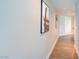 Hallway features sleek wood flooring, modern art, and recessed lighting, leading to other rooms in the unit at 2700 Las Vegas Blvd # 2303, Las Vegas, NV 89109