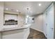 Kitchen with gray countertops, sleek white cabinets and stainless steel appliances at 2700 Las Vegas Blvd # 2303, Las Vegas, NV 89109