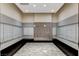 Well-lit mailroom area with individual mailboxes, convenient seating, and contemporary design for residents at 2700 Las Vegas Blvd # 2303, Las Vegas, NV 89109