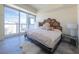 Bright bedroom featuring large windows with city views and unique honeycomb patterned headboard at 2700 Las Vegas Blvd # 2809, Las Vegas, NV 89109