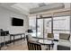 Comfortable common area featuring modern furniture, TV, and access to the balcony at 2700 Las Vegas Blvd # 2809, Las Vegas, NV 89109