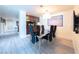 Modern dining room featuring a sleek black table, six chairs, and contemporary light fixture at 2700 Las Vegas Blvd # 2809, Las Vegas, NV 89109