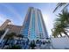 High-rise condo with pool and palm trees on sunny day at 2700 Las Vegas Blvd # 2809, Las Vegas, NV 89109