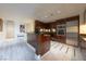 Condo kitchen with wood cabinets, stainless appliances, and eat-in counter at 2700 Las Vegas Blvd # 2809, Las Vegas, NV 89109