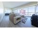 Spacious living room with a comfortable sofa, floor-to-ceiling windows and city views at 2700 Las Vegas Blvd # 2809, Las Vegas, NV 89109