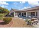 Lush backyard featuring a covered patio, desert landscaping, and inviting lounge area at 2862 Sapphire Desert Dr, Henderson, NV 89052