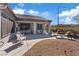 Inviting backyard oasis with covered patio, lounge chairs, and desert plants at 2862 Sapphire Desert Dr, Henderson, NV 89052