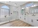 Modern bathroom with a glass-enclosed shower, double vanity, and stylish fixtures at 2862 Sapphire Desert Dr, Henderson, NV 89052