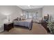 Serene bedroom with bay window, plush carpet, and neutral décor at 2862 Sapphire Desert Dr, Henderson, NV 89052