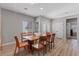 Inviting dining room featuring natural light, wood floors, and a modern table with seating at 2862 Sapphire Desert Dr, Henderson, NV 89052