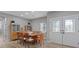 Spacious dining area with elegant double doors, wood flooring, and stylish decor at 2862 Sapphire Desert Dr, Henderson, NV 89052