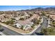 Expansive view of a single-story home with a two-car garage, manicured front yard and desert landscaping, in a suburban neighborhood at 2862 Sapphire Desert Dr, Henderson, NV 89052