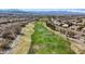 Scenic view of a lush green golf course with mature trees and surrounding homes in a vibrant community at 2862 Sapphire Desert Dr, Henderson, NV 89052