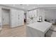 Well-lit kitchen boasts white cabinets, quartz countertops, and stainless appliances at 2862 Sapphire Desert Dr, Henderson, NV 89052