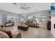 Spacious living area with large windows and natural light, featuring a ceiling fan at 2862 Sapphire Desert Dr, Henderson, NV 89052